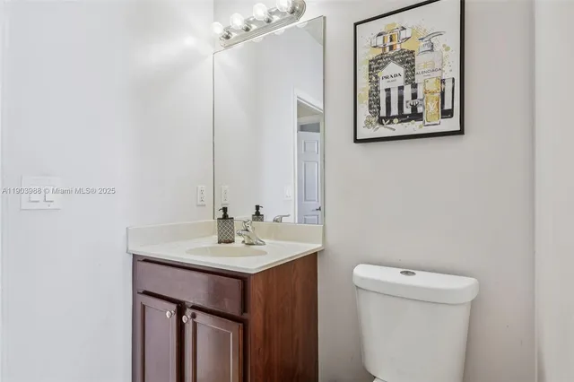 a view of a room with workspace and a window