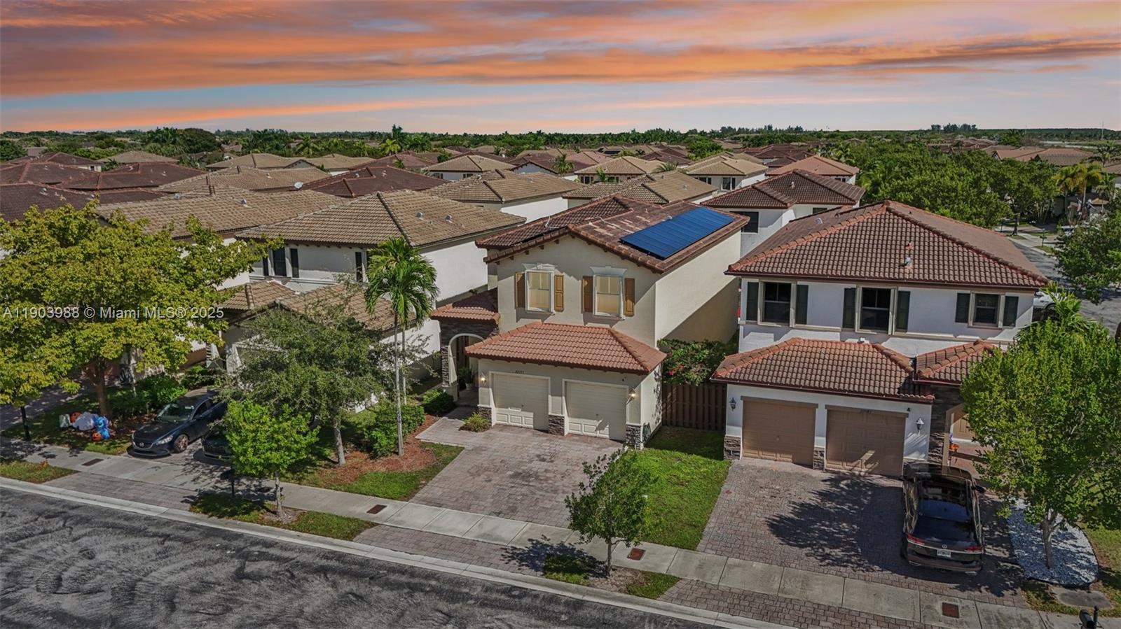 22777 Southwest 93rd Court Cutler Bay, FL 33190 - Photo 2 of 54 front view of a house with a yard