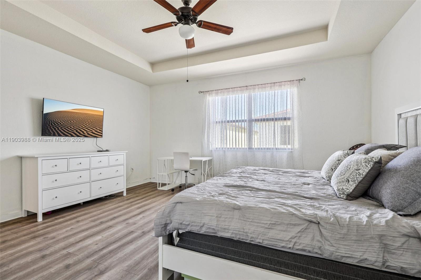 22777 Southwest 93rd Court Cutler Bay, FL 33190 - Photo 26 of 54 a bedroom with a bed and a flat screen tv