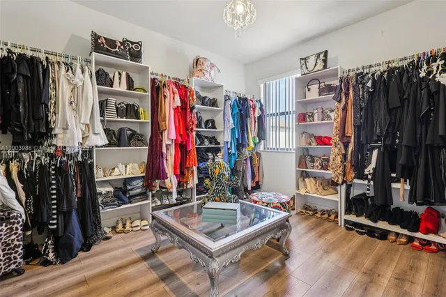 a white bath tub sitting next to a toilet
