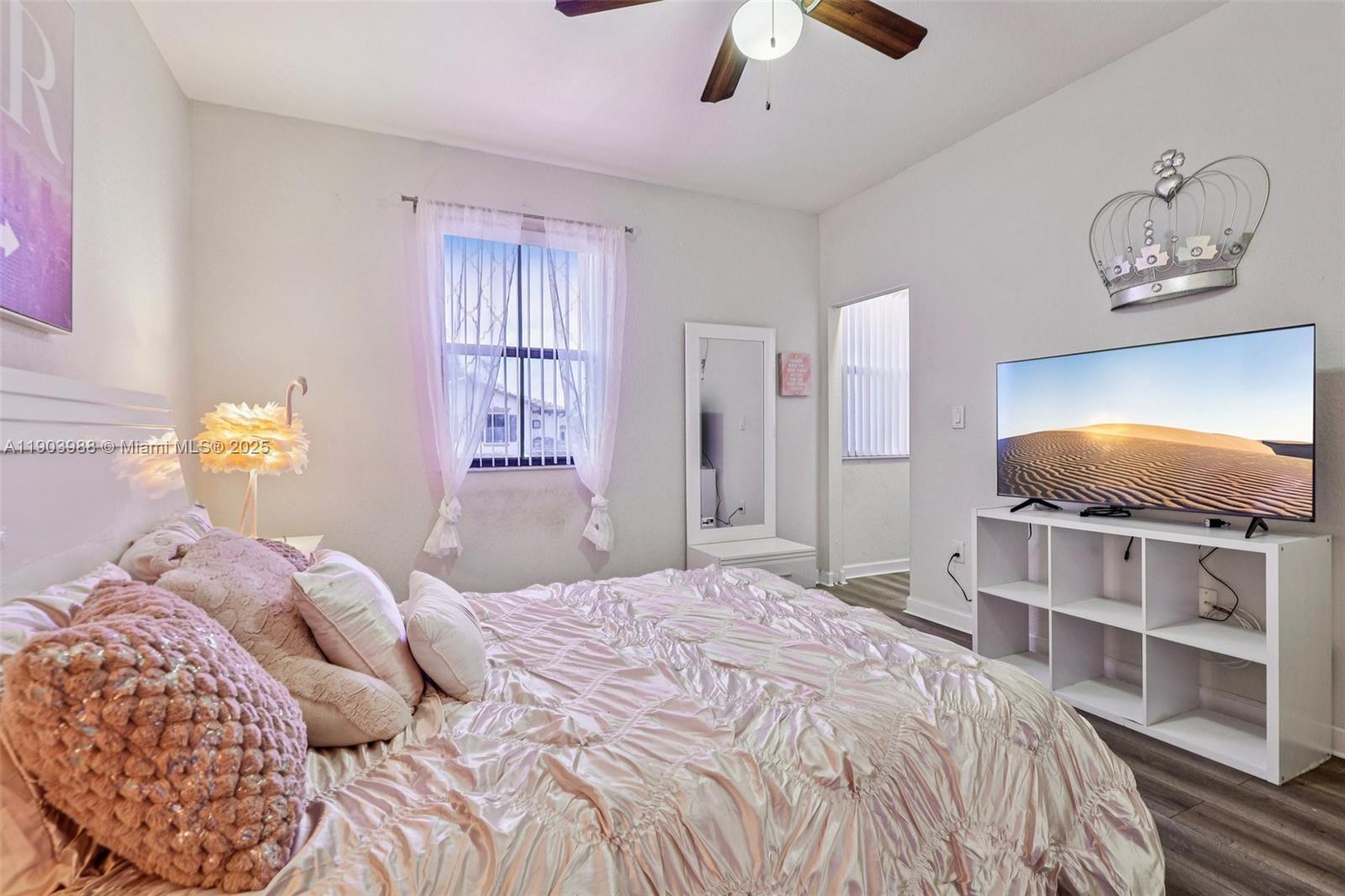 22777 Southwest 93rd Court Cutler Bay, FL 33190 - Photo 38 of 54 a bedroom with a bed and a flat screen tv