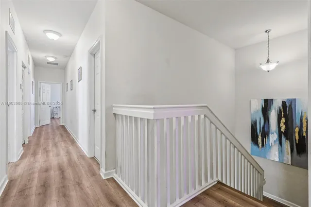 a view of a patio with a table and chairs