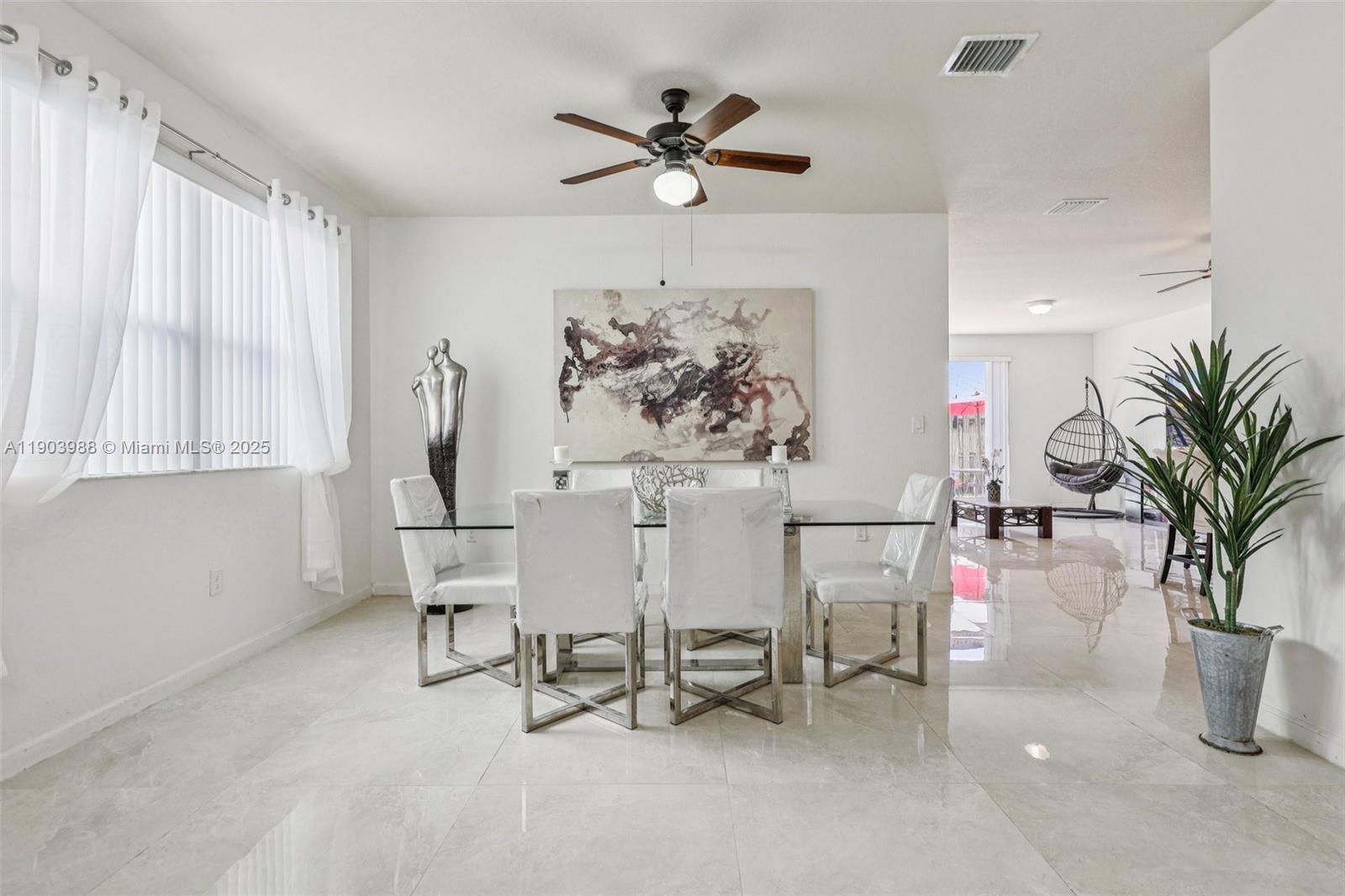 22777 Southwest 93rd Court Cutler Bay, FL 33190 - Photo 10 of 54 a view of a livingroom with furniture and a window