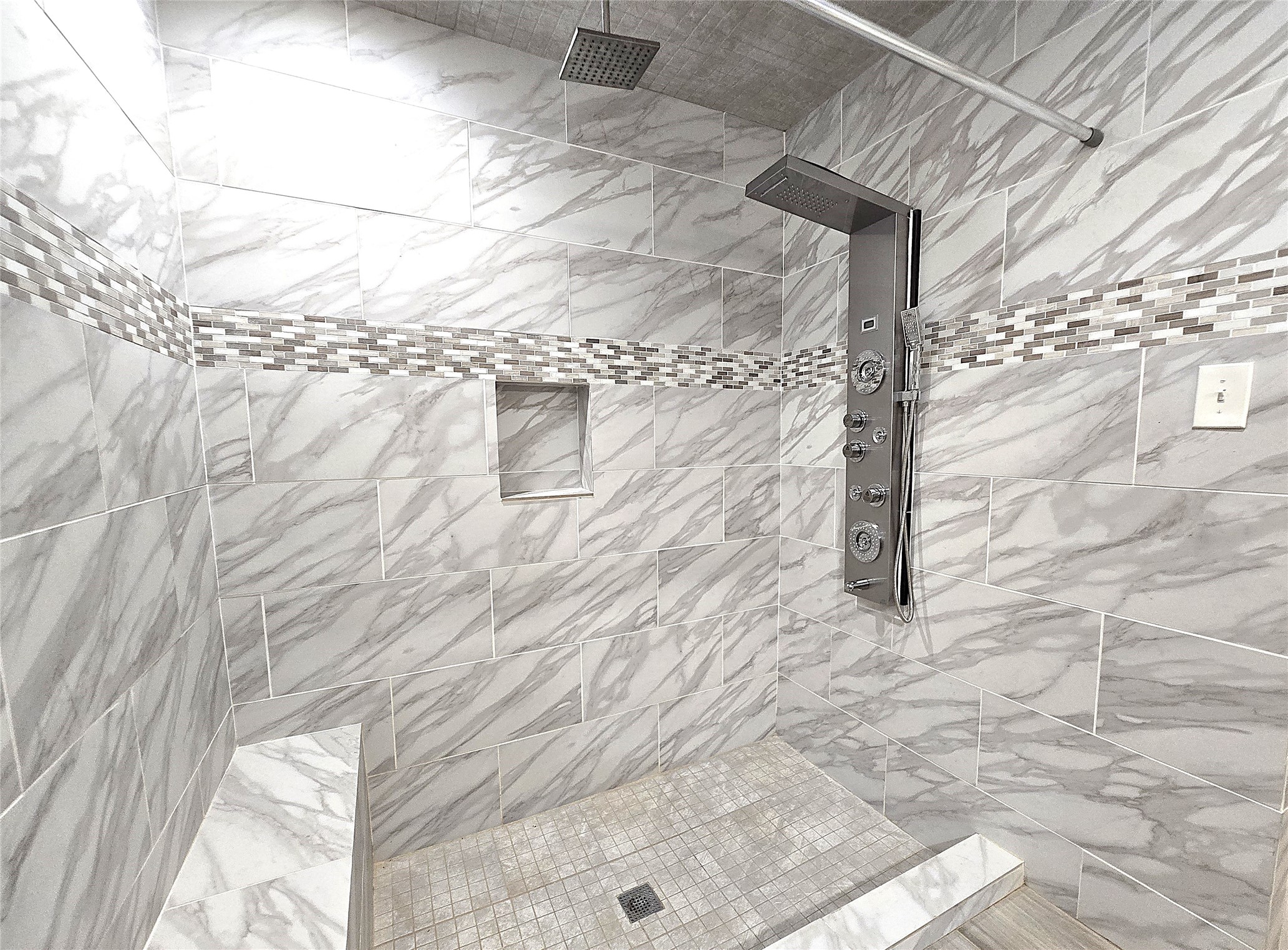 560 Brandon Road Conroe, TX 77302 - Photo 15 of 45 Luxurious master shower with modern fixtures and elegant tilework for a spa-like experience.
