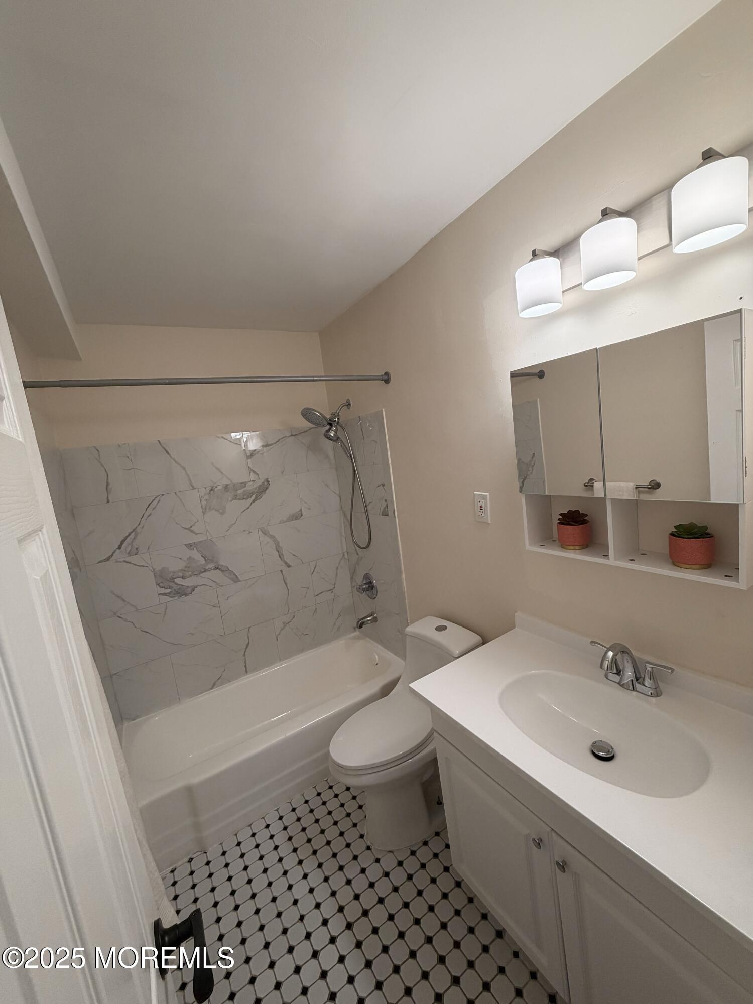 1225 John F. Kennedy Boulevard, Unit 8I Bayonne, NJ 07002 - Photo 14 of 18 a bathroom with a sink toilet and shower
