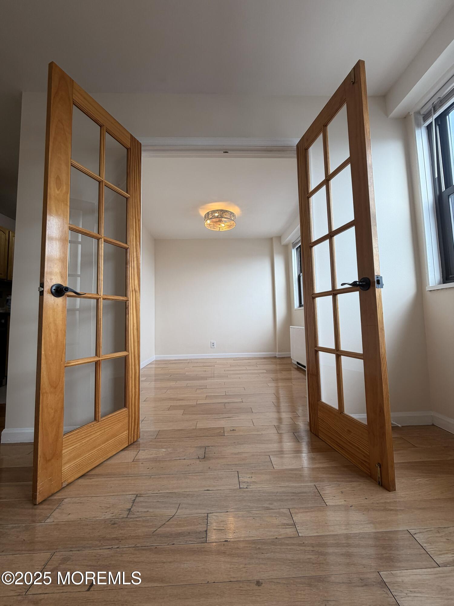 1225 John F. Kennedy Boulevard, Unit 8I Bayonne, NJ 07002 - Photo 8 of 18 a view of an empty room and window