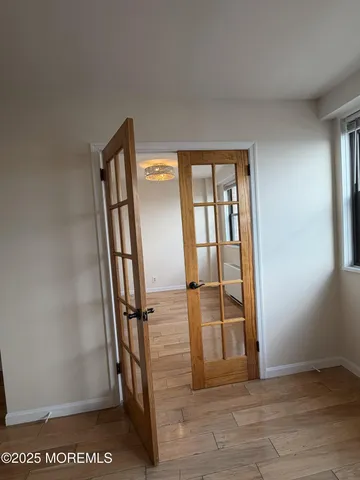 a view of entryway with wooden floor
