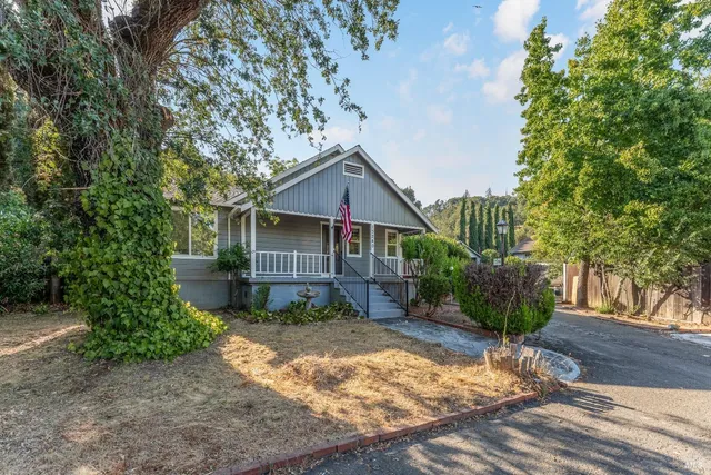 a bathroom with a shower curtain and a toilet