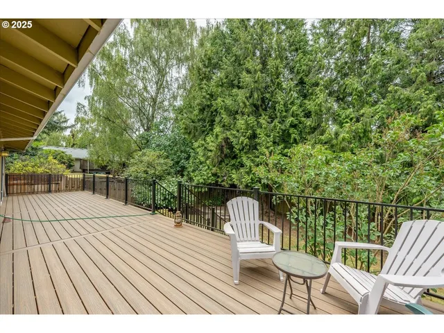 a view of balcony with wooden floor and outdoor seating