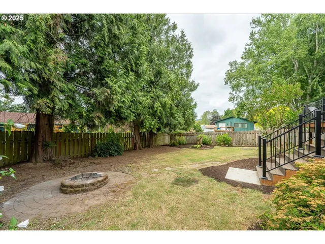 a backyard of a house with lots of green space