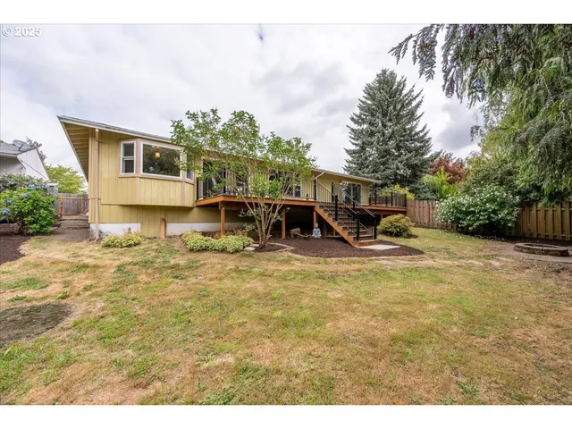 a view of a swimming pool with a yard