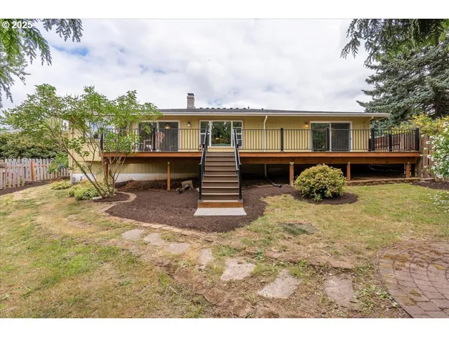 a view of a backyard of the house