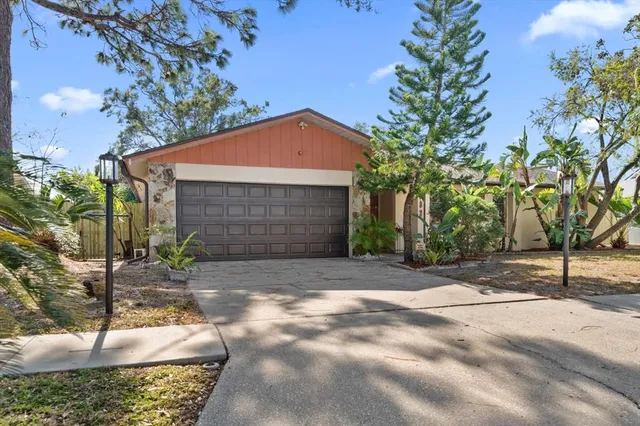 a backyard of a house with shaded area
