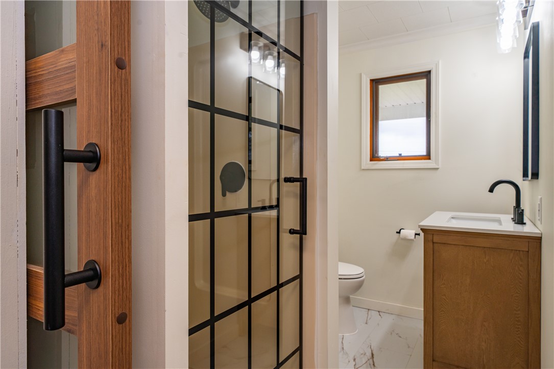 11296 Pansing Road Brookville, OH 45309 - Photo 30 of 53 This sleek bathroom features a modern shower, elegant vanity, and sophisticated fixtures.