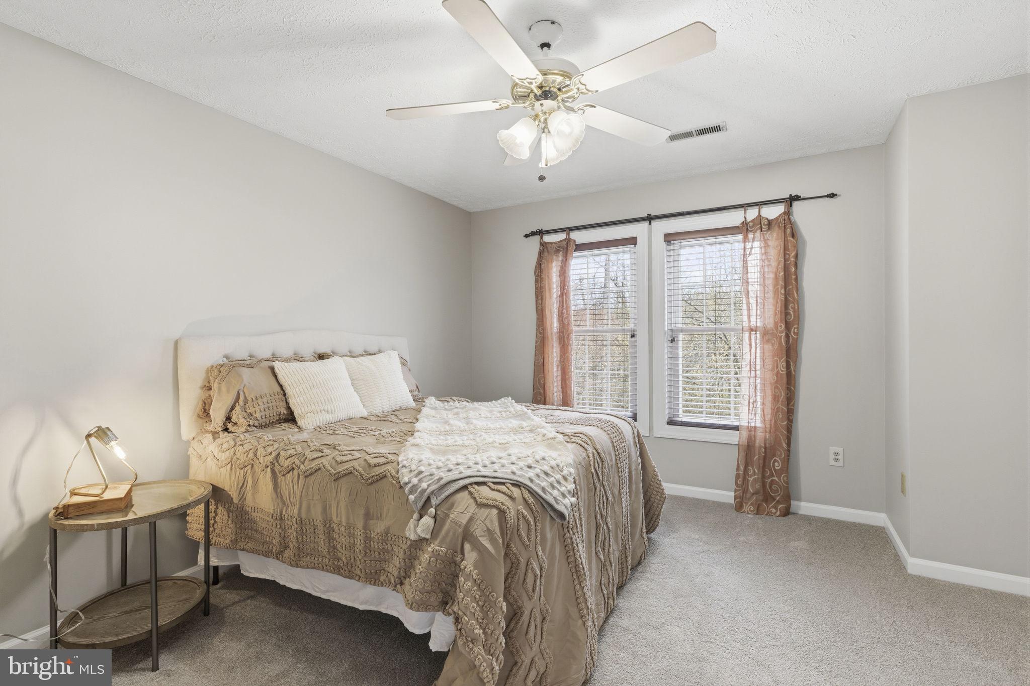 3172 Hidden Ridge Terrace Abingdon, MD 21009 - Photo 13 of 34 a bedroom with a bed and a large window