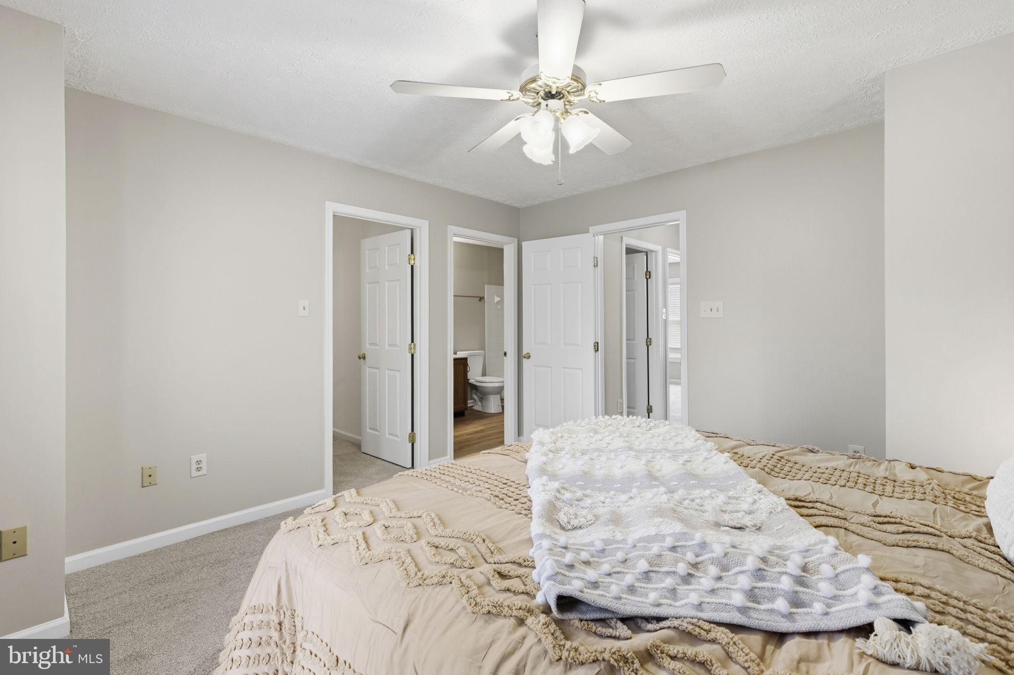 3172 Hidden Ridge Terrace Abingdon, MD 21009 - Photo 14 of 34 a bedroom with a bed and a chandelier