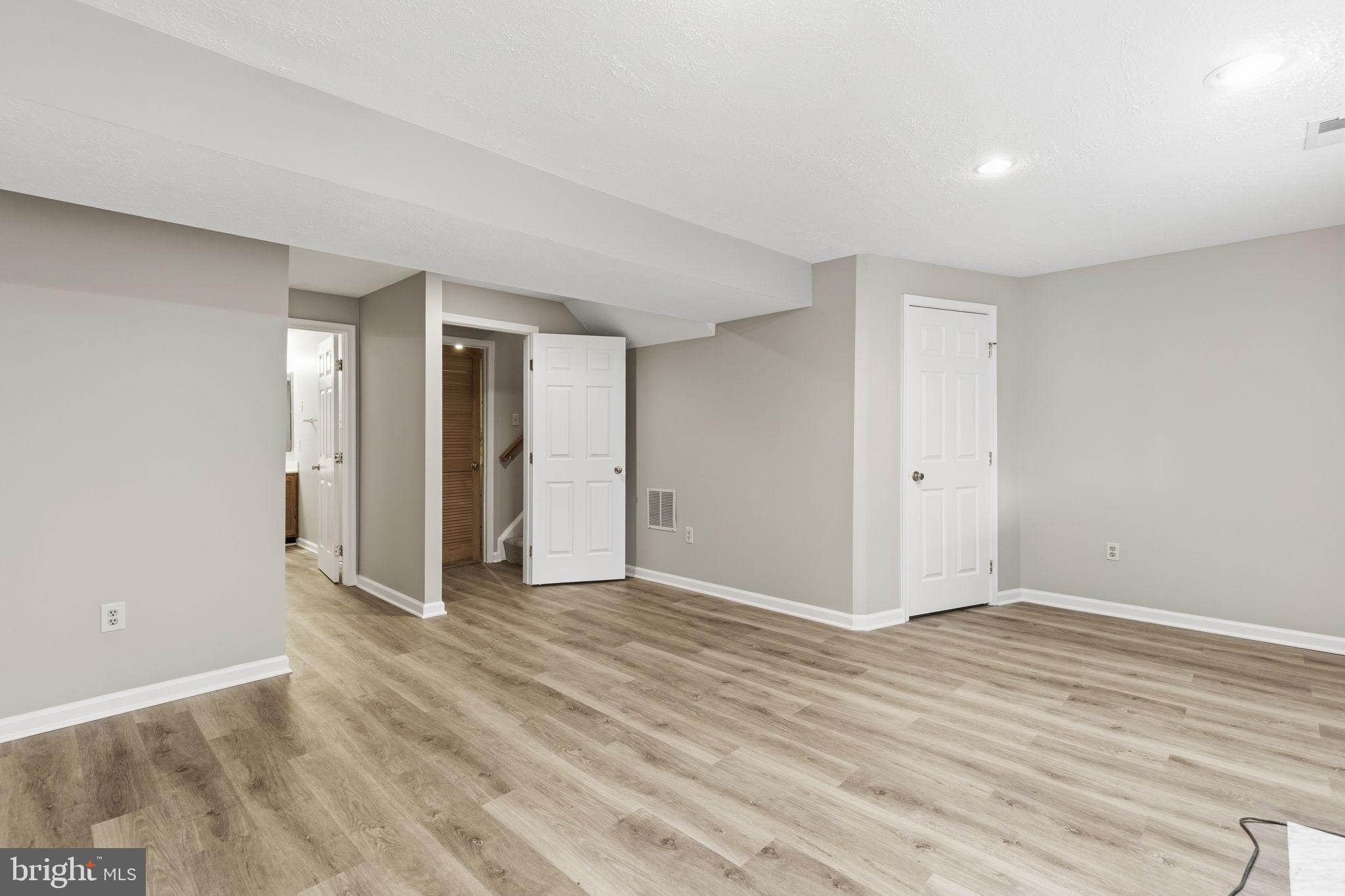 3172 Hidden Ridge Terrace Abingdon, MD 21009 - Photo 23 of 34 a view of an empty room with wooden floor