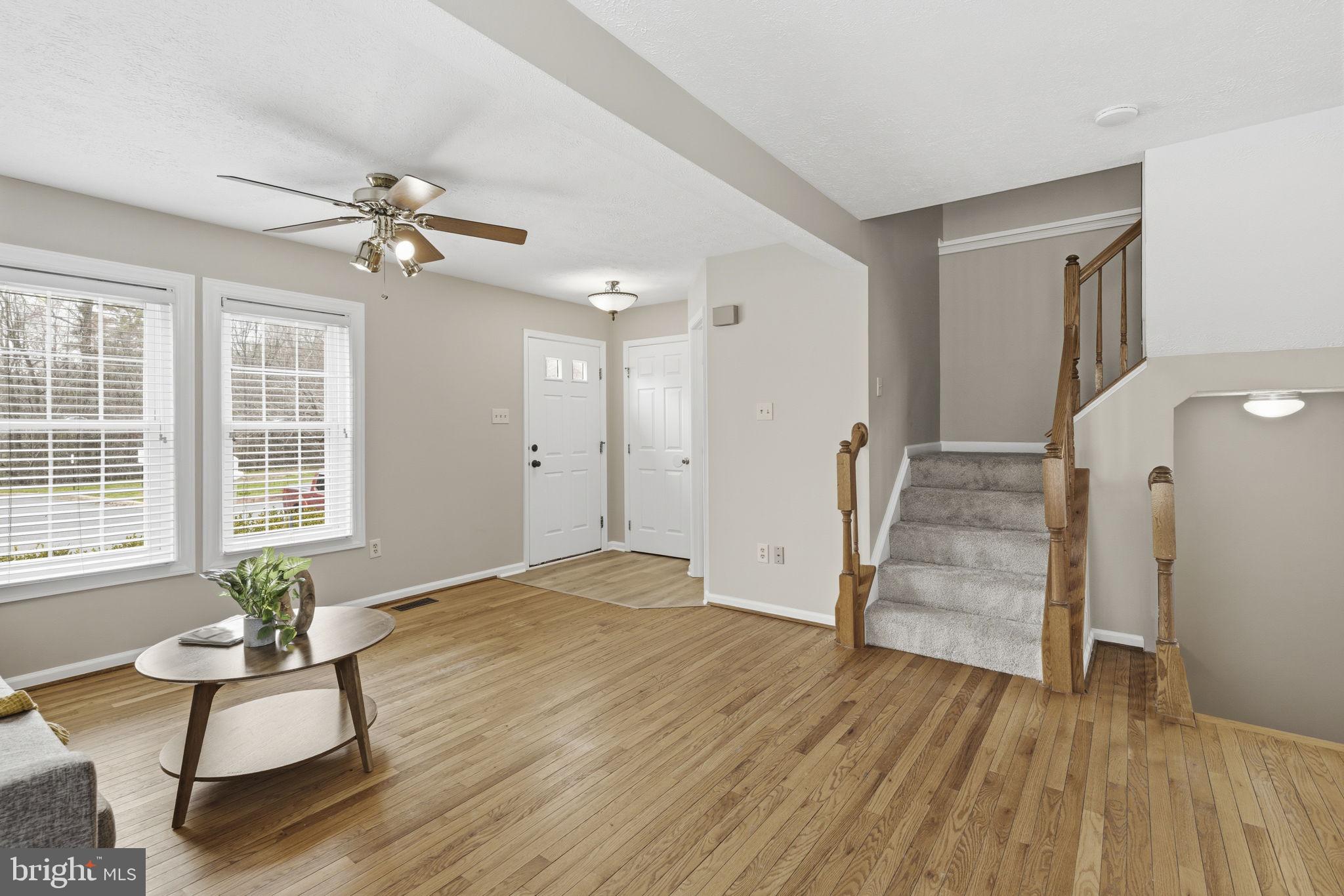 3172 Hidden Ridge Terrace Abingdon, MD 21009 - Photo 6 of 34 a view of empty room with wooden floor and fan