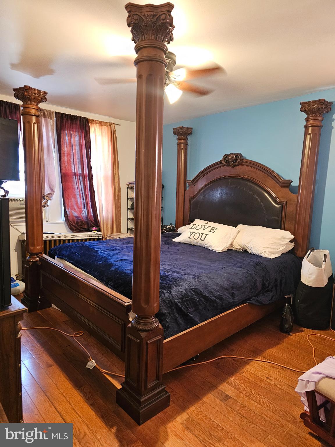 40 North Penn Street Aldan, PA 19018 - Photo 10 of 21 a bed sitting in a bedroom next to a window