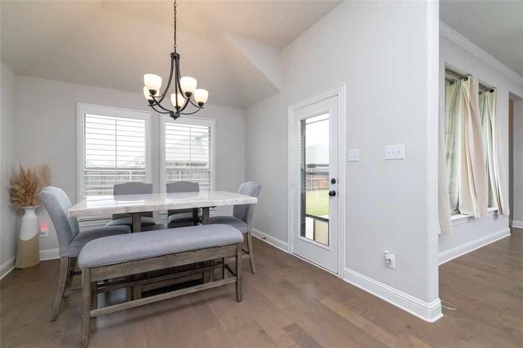 4045 Grove Valley Road Midlothian, TX 76065 - Photo 20 of 34 Dining area with a chandelier and dark wood-style floors