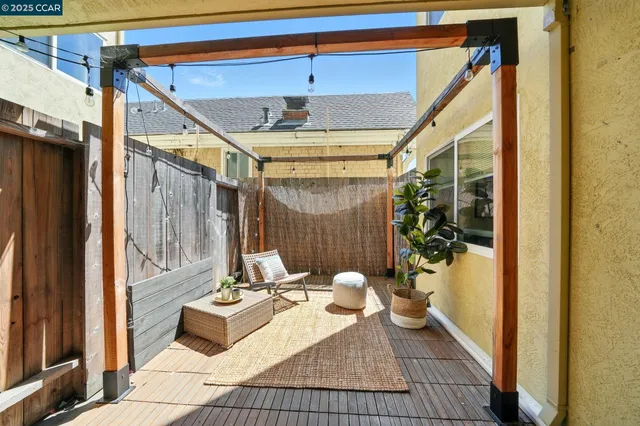 a balcony with couch and glass door