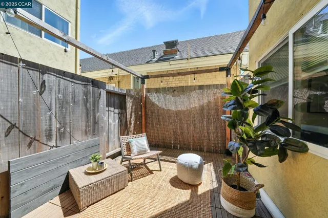 a view of a patio with couches and potted plants