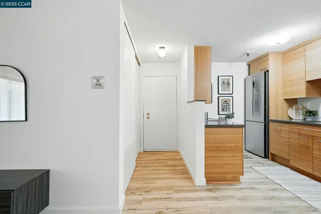 a bathroom with a tub and mirror