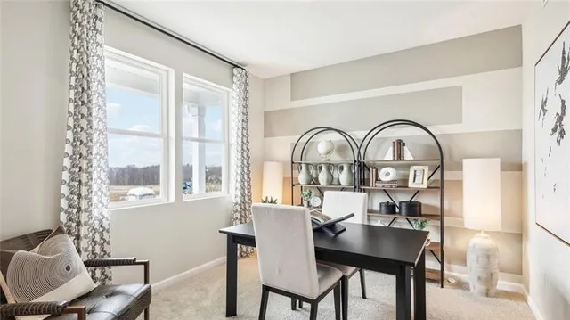 a view of a livingroom with furniture and window
