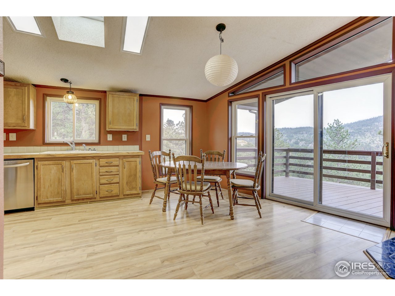 38 Ogallala Road Lyons, CO 80540 - Photo 10 of 38 Kitchen/dining w/ laminated wood floors