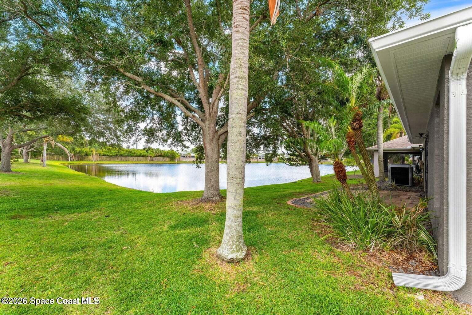 4741 Decatur Circle Melbourne, FL 32934 - Photo 41 of 44 a view of a backyard with large trees