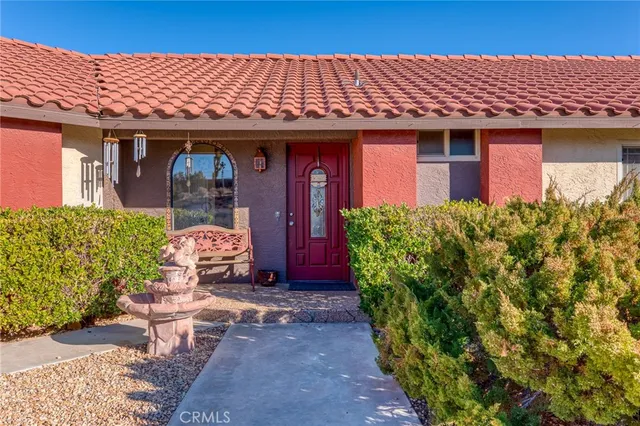 a kitchen with sink stove and cabinets