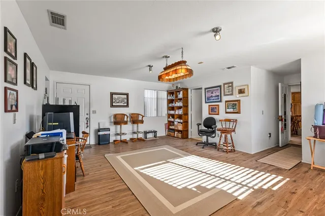 a bathroom with a granite countertop toilet sink and mirror