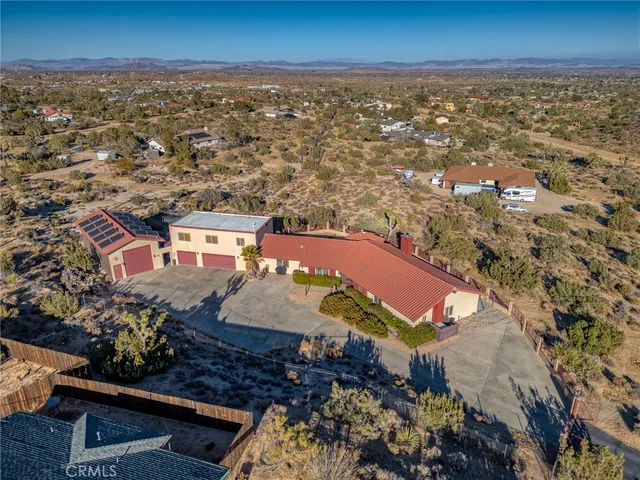aerial view of a house with a ocean view