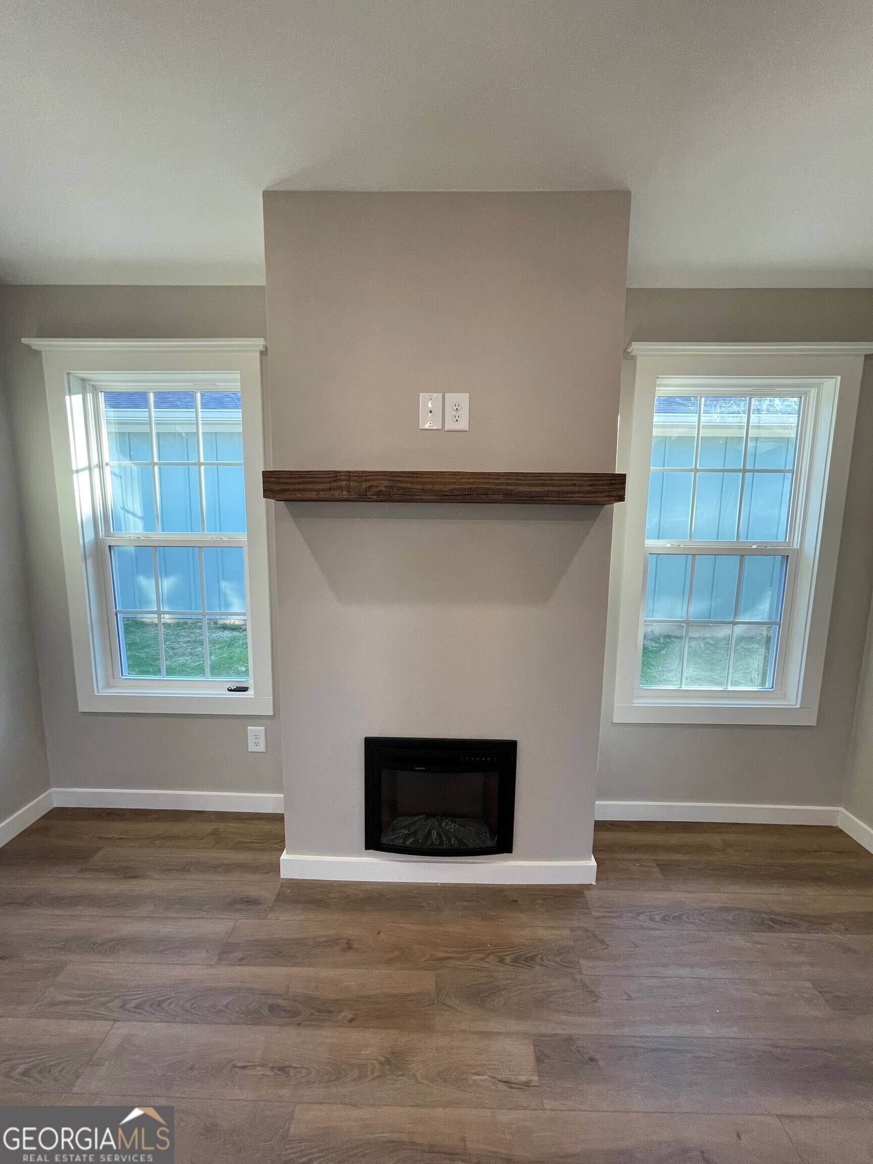 410 Hardy Avenue Southwest Rome, GA 30161 - Photo 16 of 36 a living room with a fireplace and a window