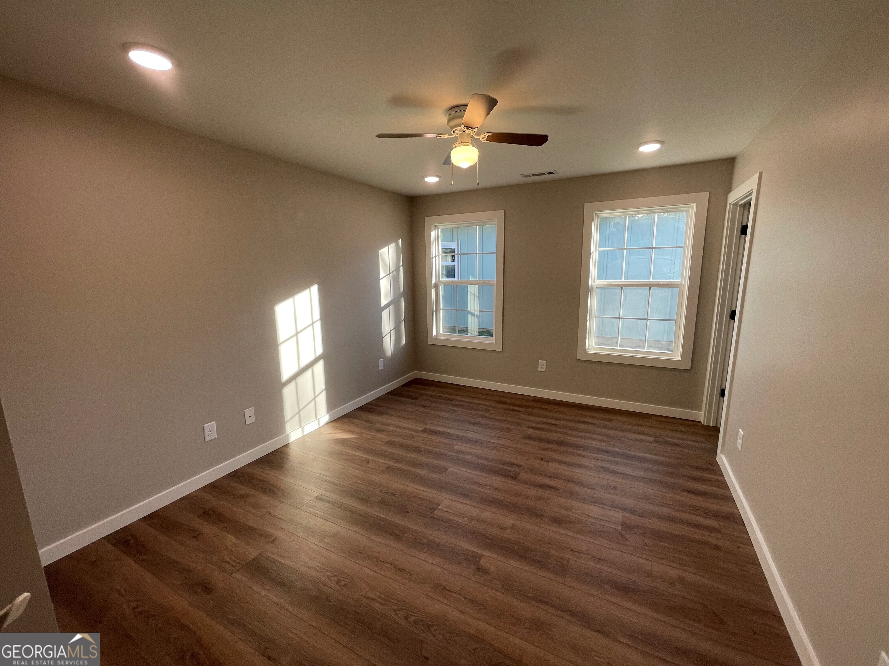 410 Hardy Avenue Southwest Rome, GA 30161 - Photo 24 of 36 a view of an empty room with wooden floor and a window