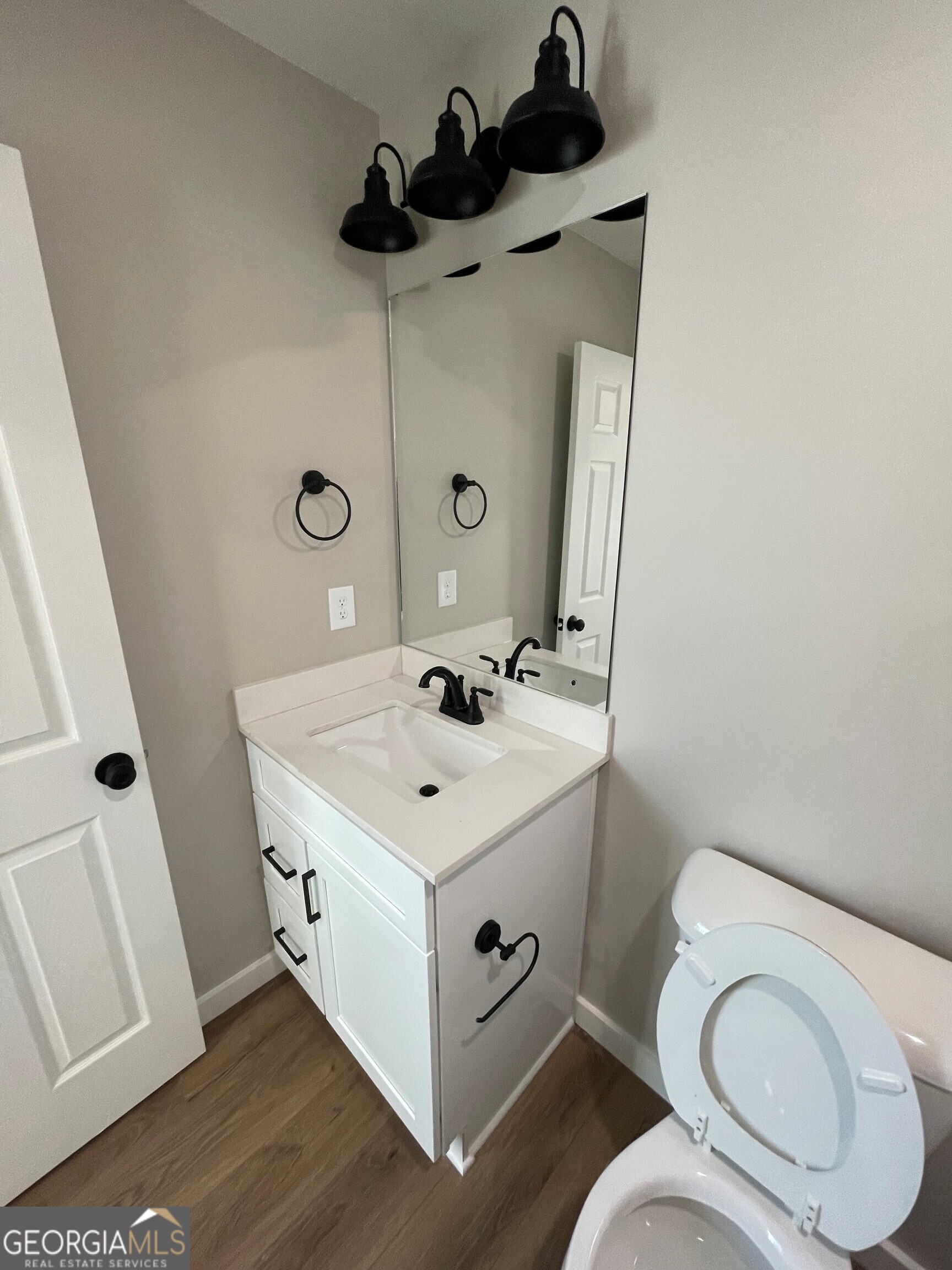 410 Hardy Avenue Southwest Rome, GA 30161 - Photo 29 of 36 a bathroom with a toilet sink and mirror