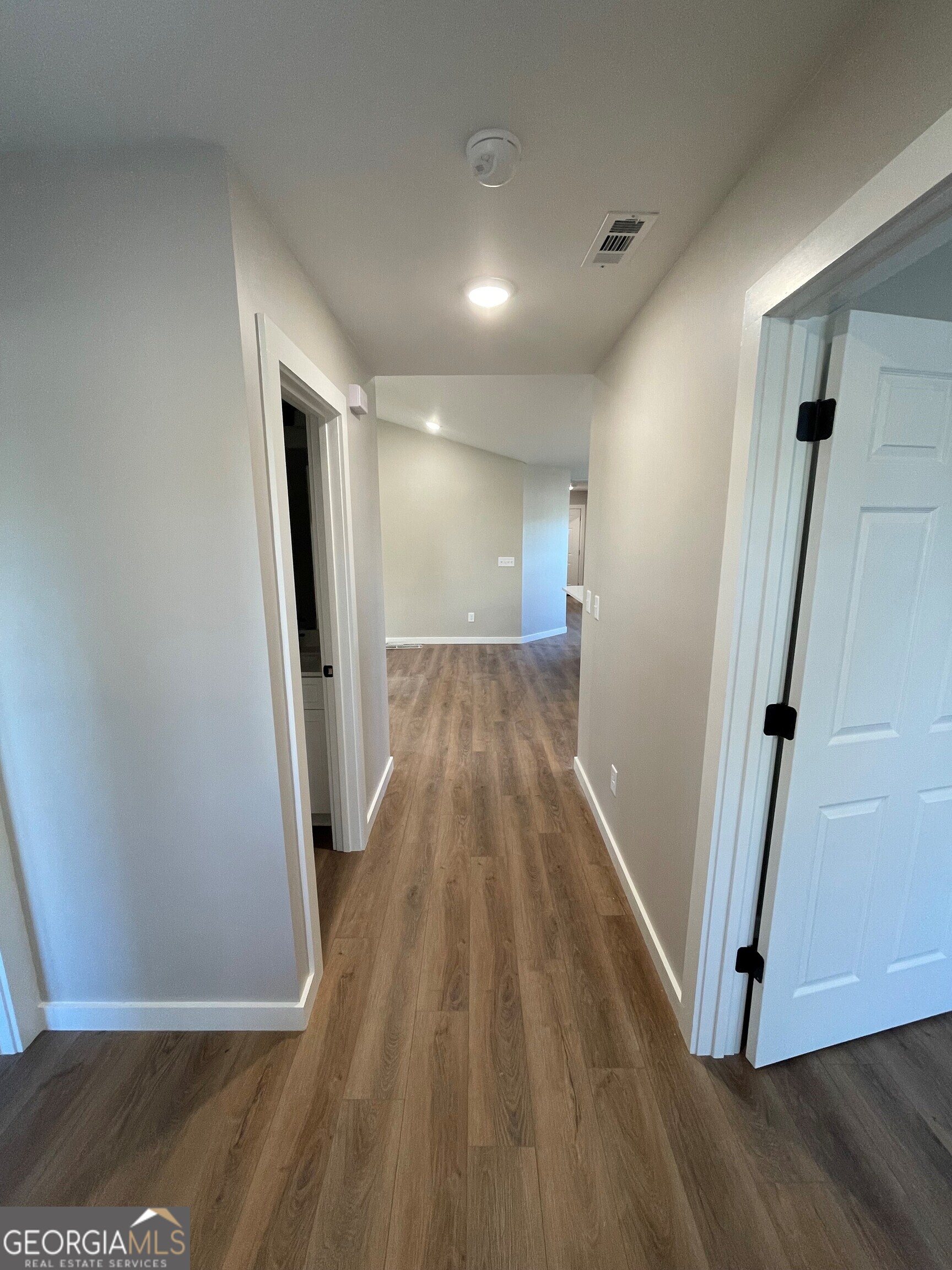 410 Hardy Avenue Southwest Rome, GA 30161 - Photo 4 of 36 a view of a hallway with wooden floor and staircase