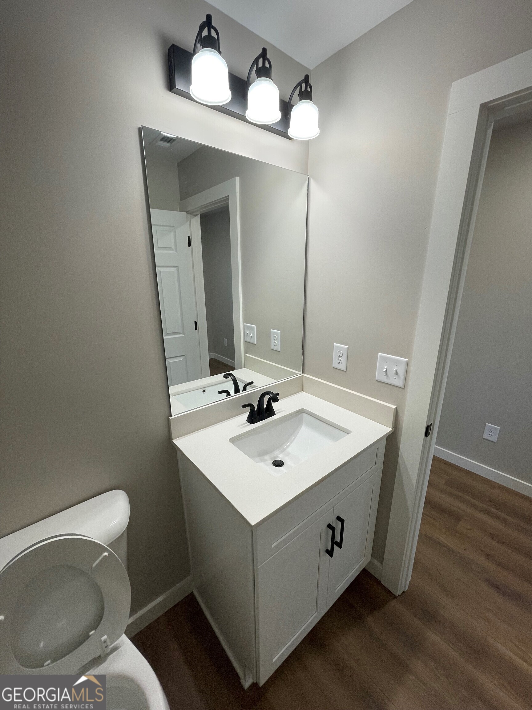 410 Hardy Avenue Southwest Rome, GA 30161 - Photo 9 of 36 a bathroom with a sink mirror and toilet