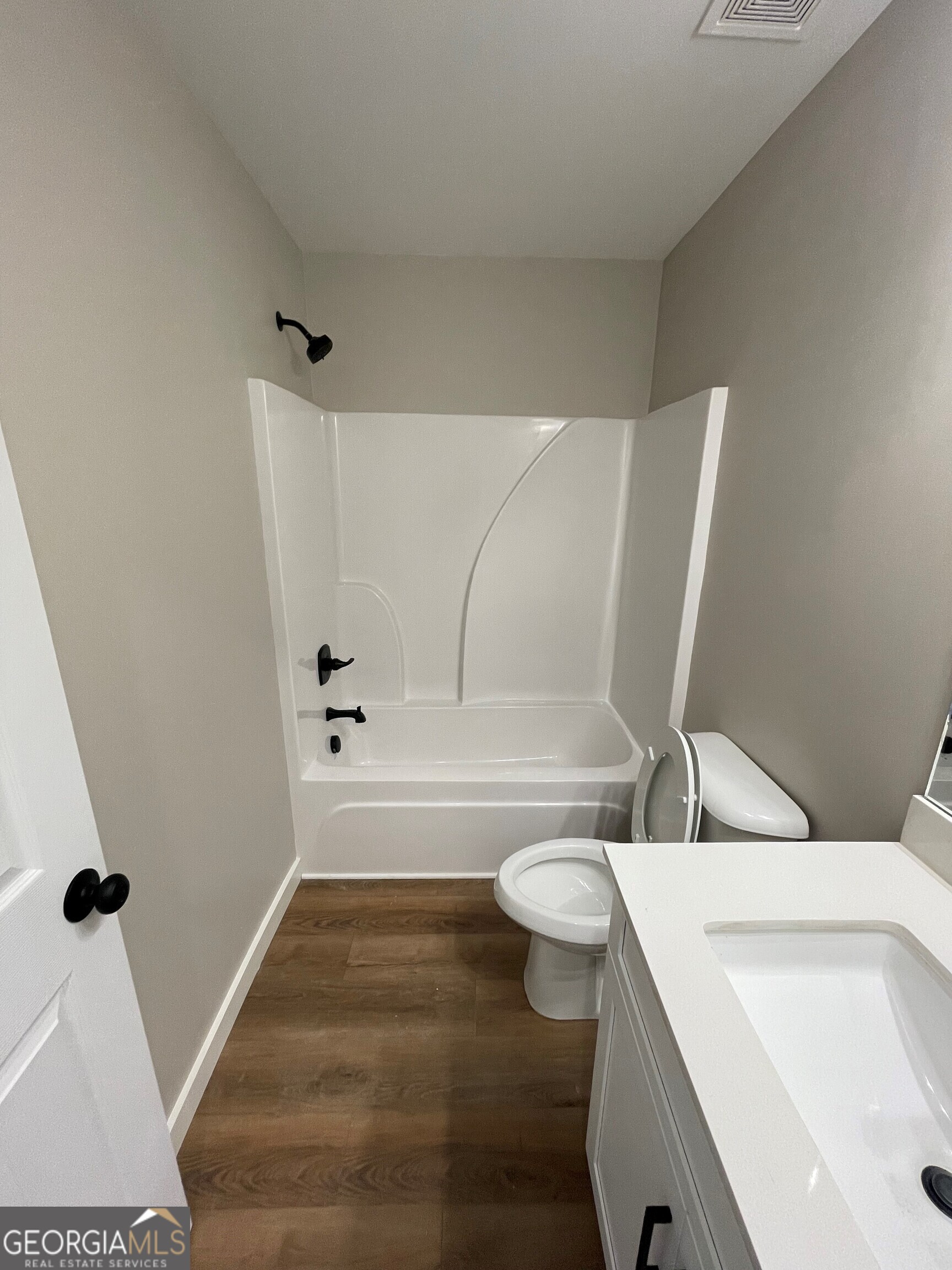 410 Hardy Avenue Southwest Rome, GA 30161 - Photo 10 of 36 a bathroom with a sink a toilet and bathtub