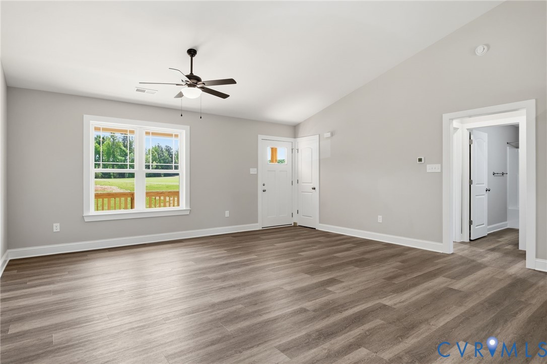 17557 Hewlett Road Beaverdam, VA 23015 - Photo 7 of 29 a view of an empty room with wooden floor and a window