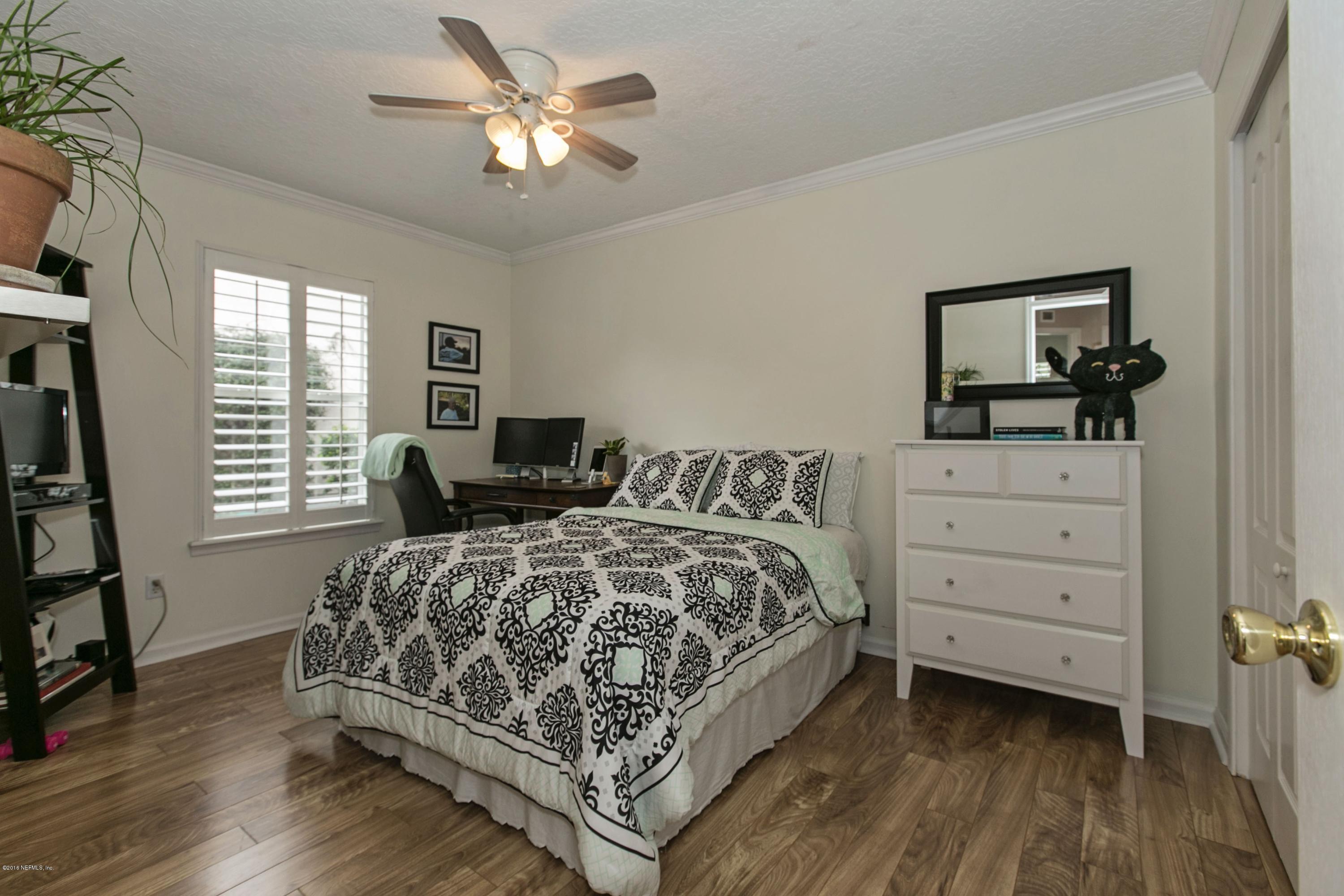445 Big Tree Road Ponte Vedra Beach, FL 32082 - Photo 18 of 23 a bedroom with a bed and a dresser