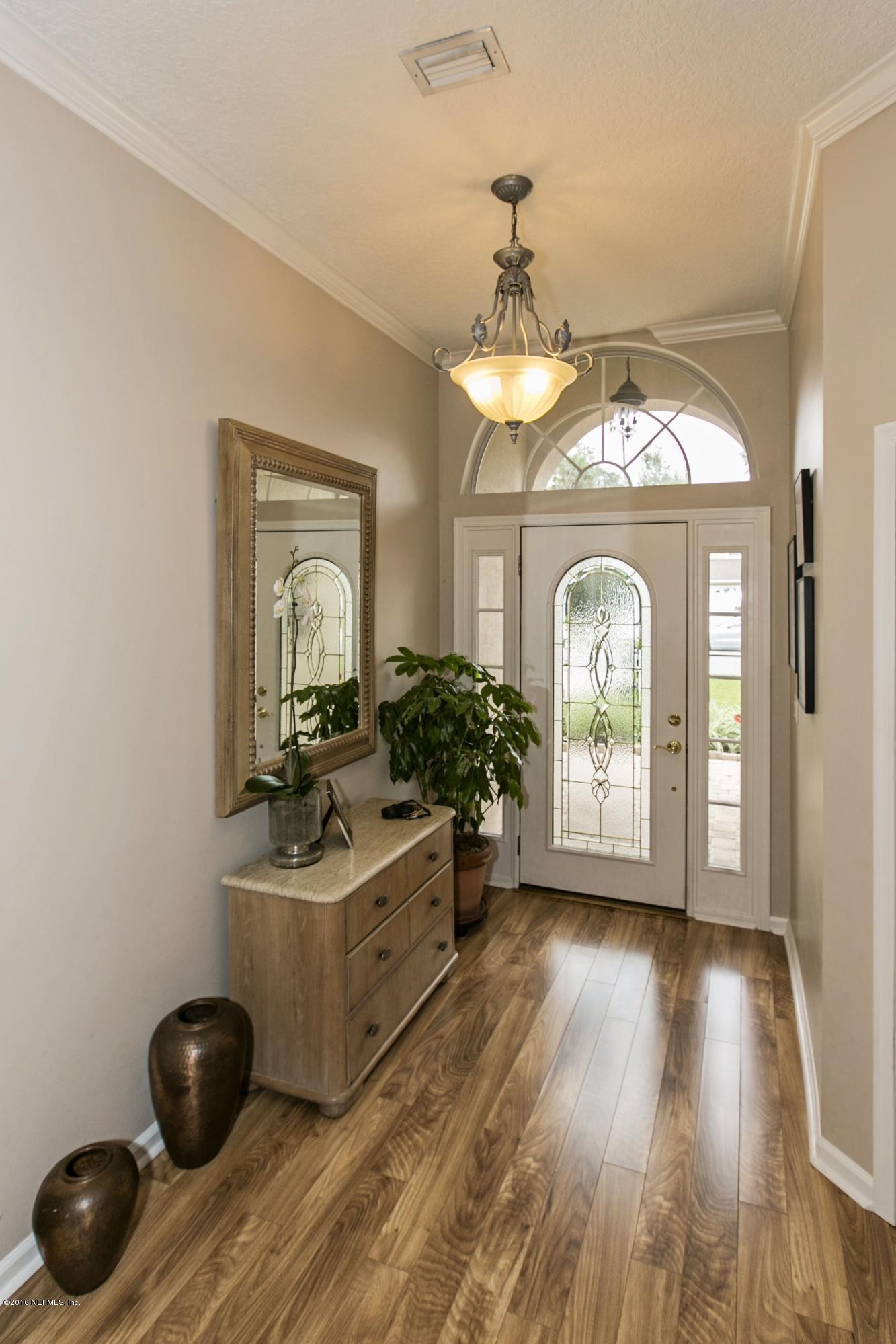 445 Big Tree Road Ponte Vedra Beach, FL 32082 - Photo 3 of 23 a view of a livingroom with furniture window and wooden floor