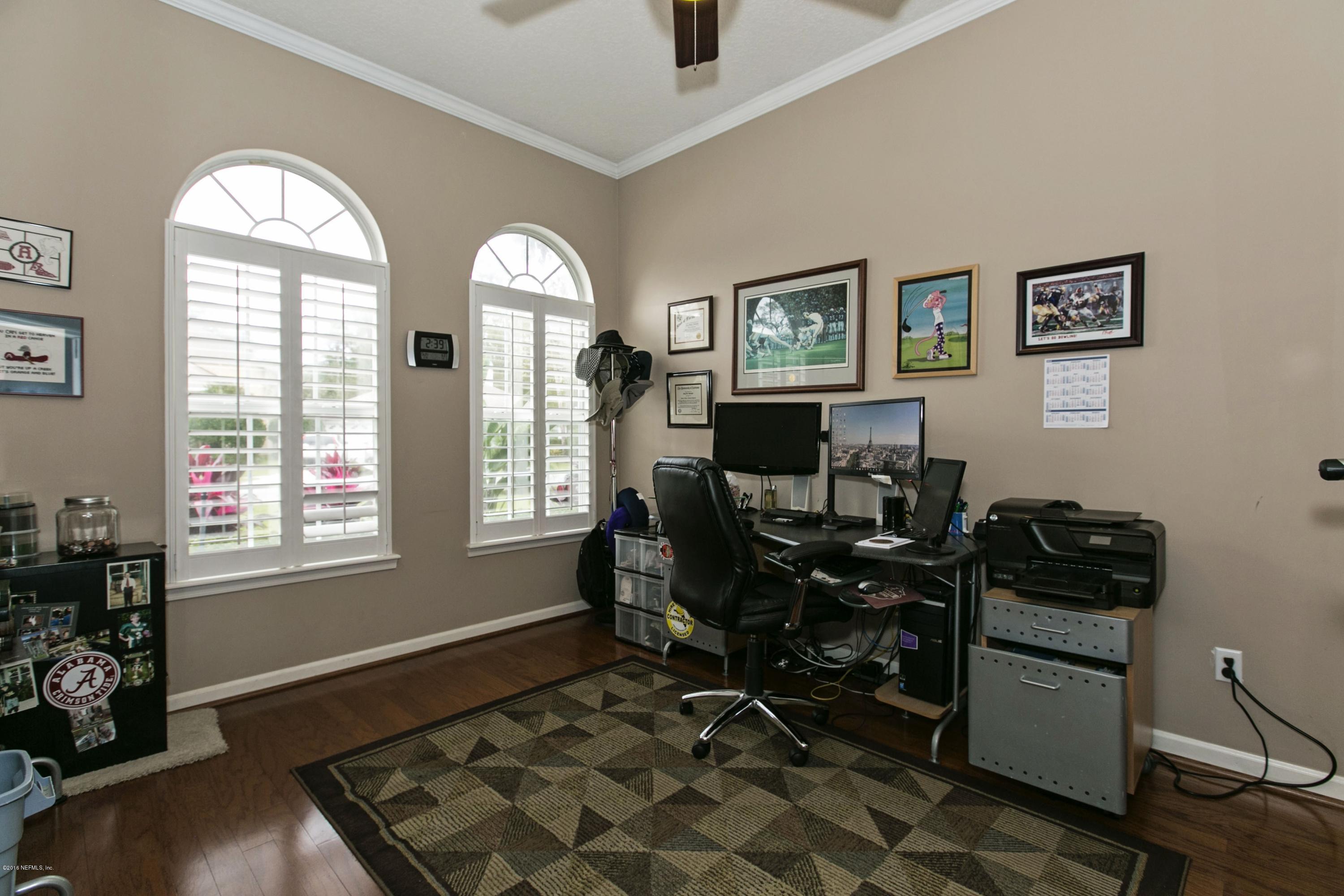 445 Big Tree Road Ponte Vedra Beach, FL 32082 - Photo 4 of 23 a view of a livingroom with workspace and a window