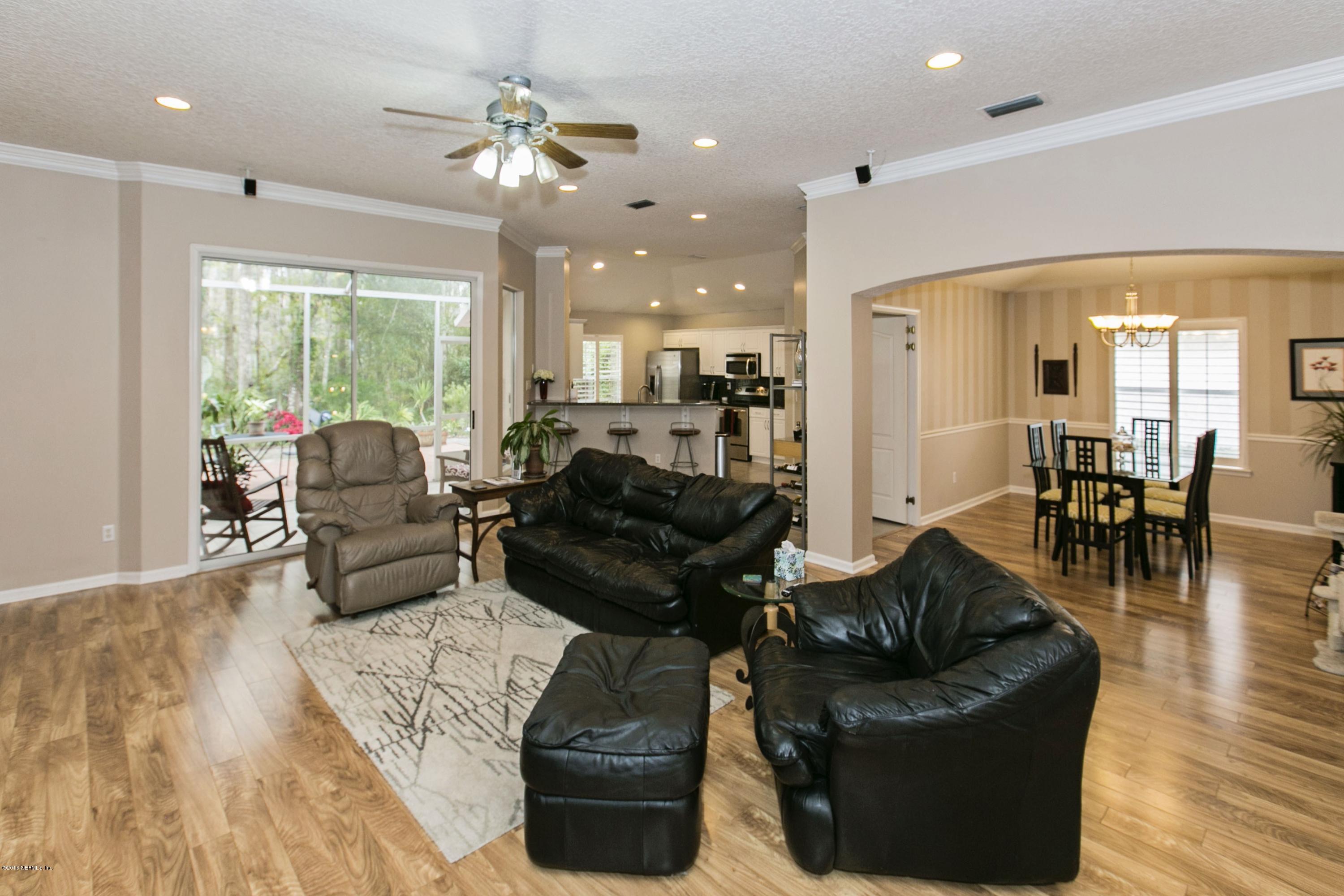 445 Big Tree Road Ponte Vedra Beach, FL 32082 - Photo 10 of 23 a living room with furniture and a large window