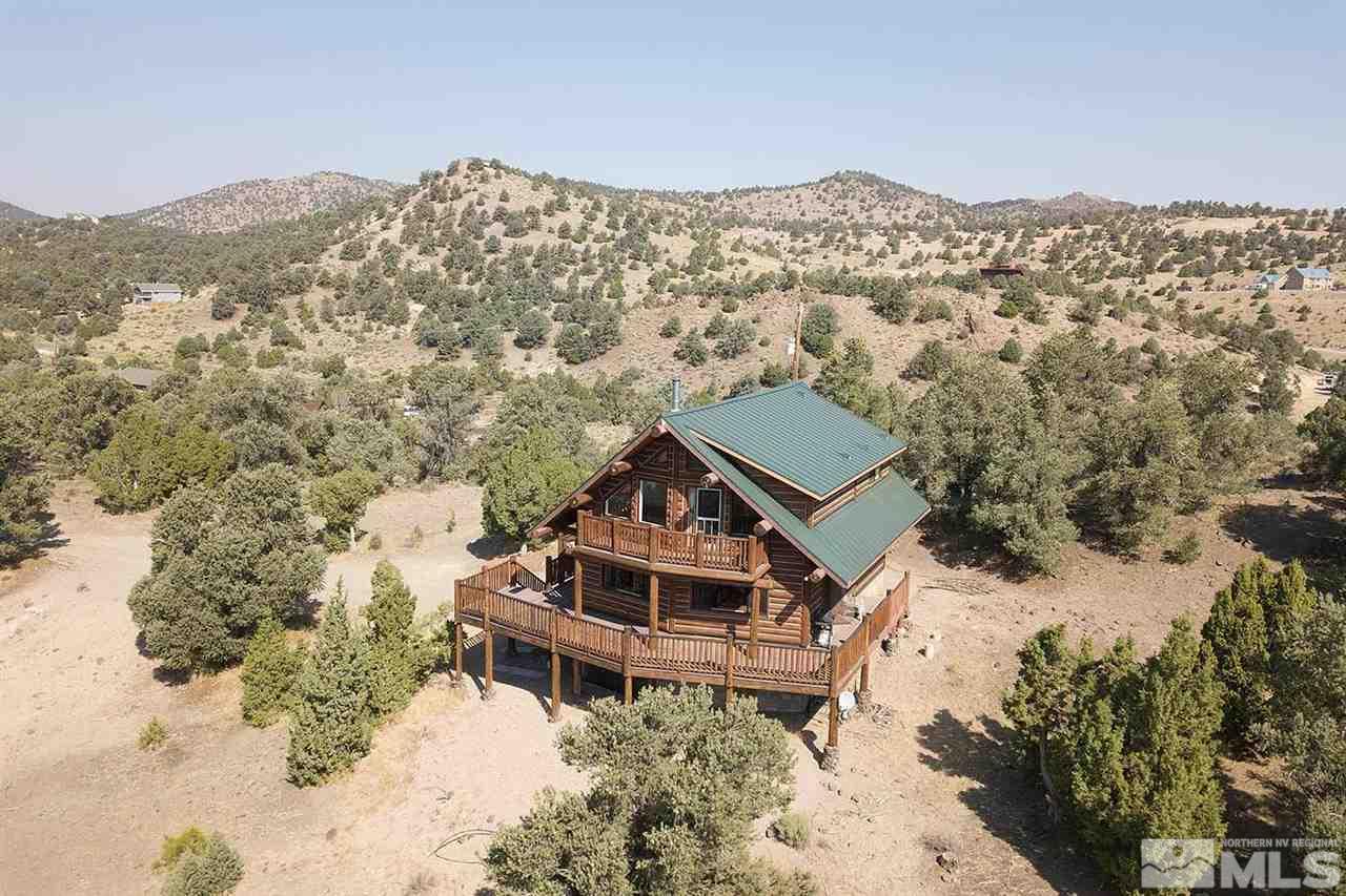 2441 Enterprise Road Reno, NV 89521 - Photo 1 of 25 an aerial view of a house with a yard