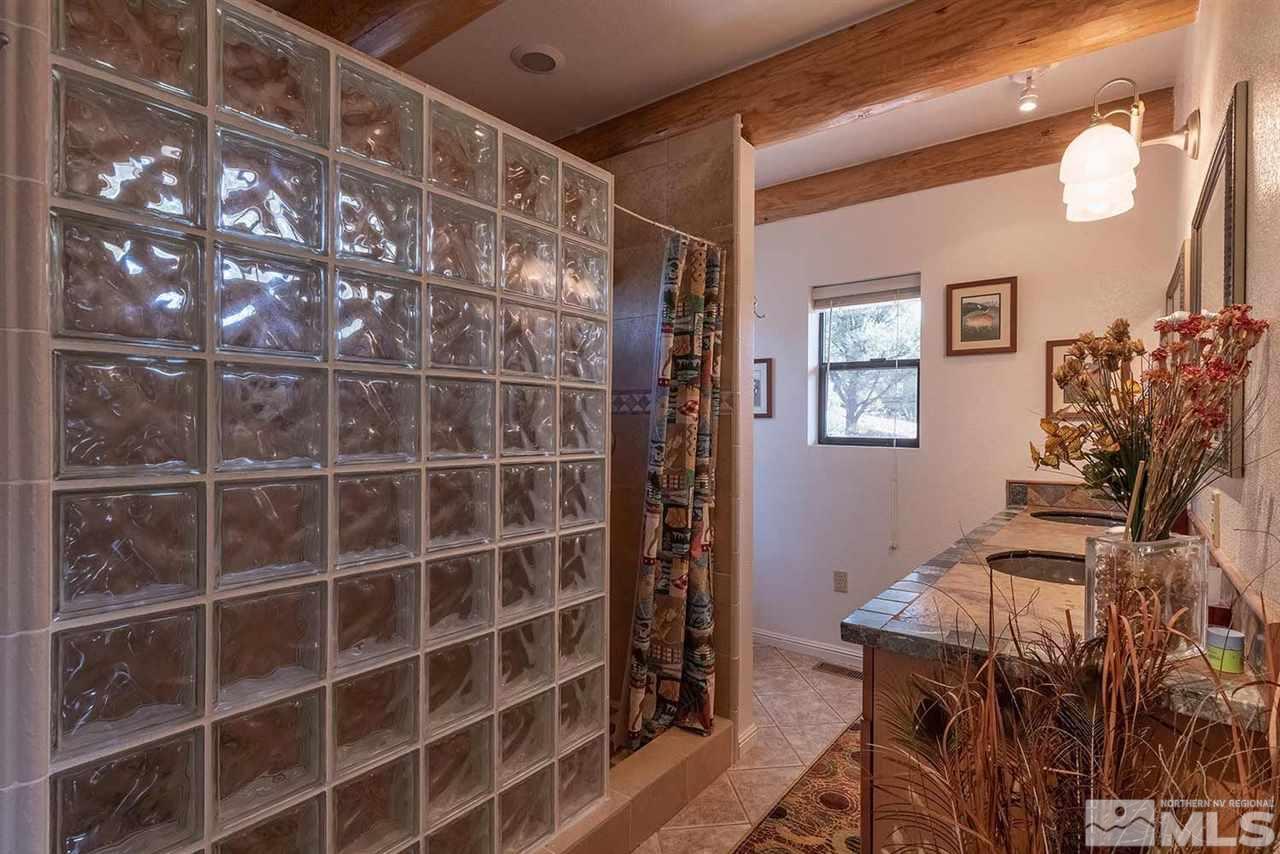 2441 Enterprise Road Reno, NV 89521 - Photo 12 of 25 a view of workspace with wooden floor and windows
