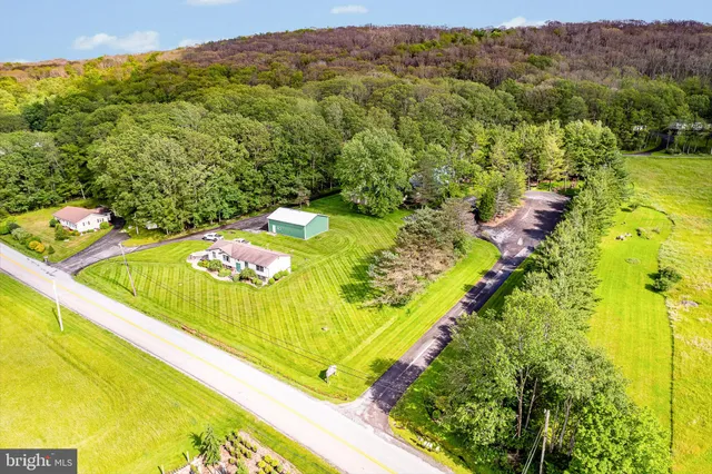 a view of a swimming pool with a yard