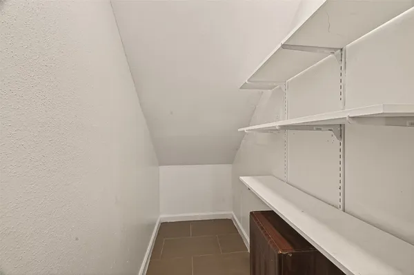 a view of an empty walk in closet