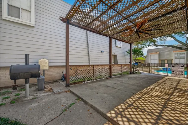 a view of a backyard with sitting area