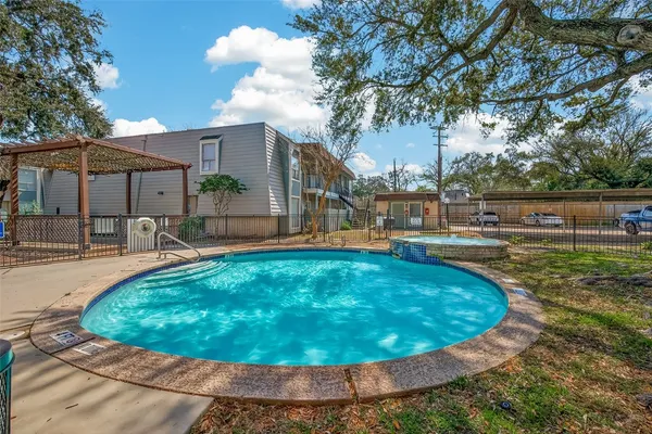 a view of a swimming pool with a patio